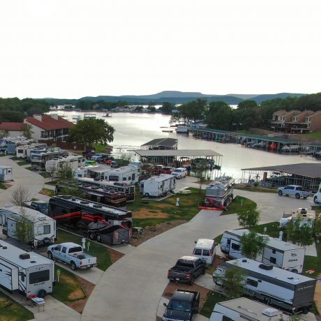aerial view of possum lake and RV parking with grass